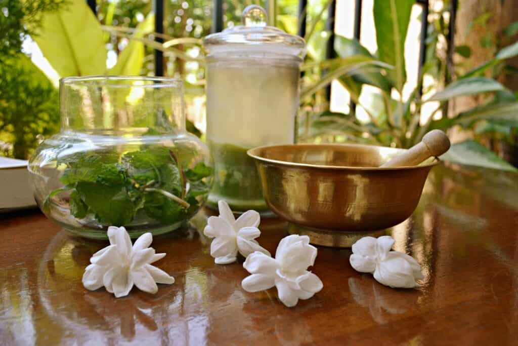 Ayurvedic beauty ingredients laid out on a wooden surface