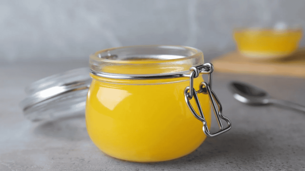 Golden ghee in a glass jar, the hero ingredient in Ayurvedic skincare